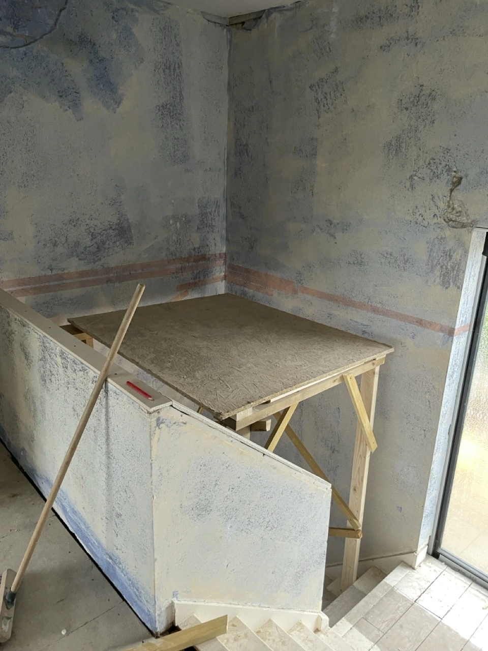 Landing and stairway coated in blue grit, ready to be skimmed